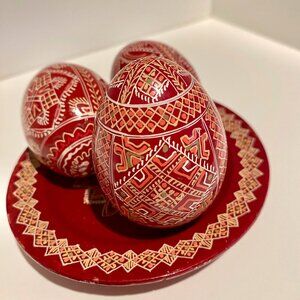 Wooden plate with wooden Ukrainian Easter Eggs